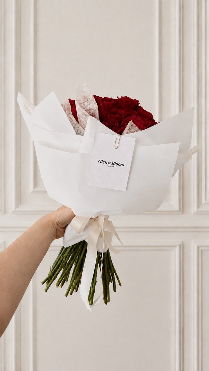 Classic Glen and Bloom rose bouquet in signature white wrapping