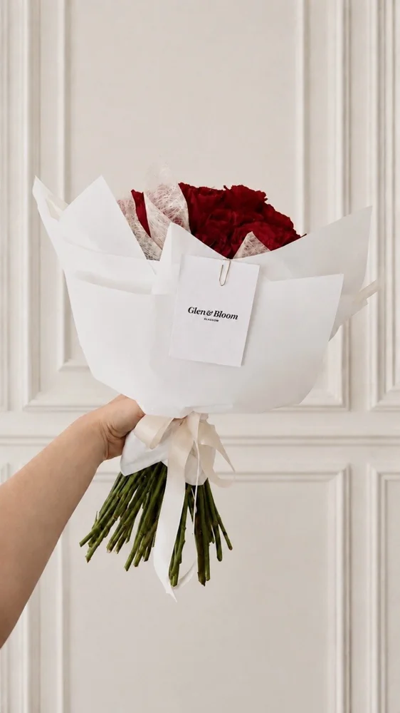 Classic Glen and Bloom rose bouquet in signature white wrapping