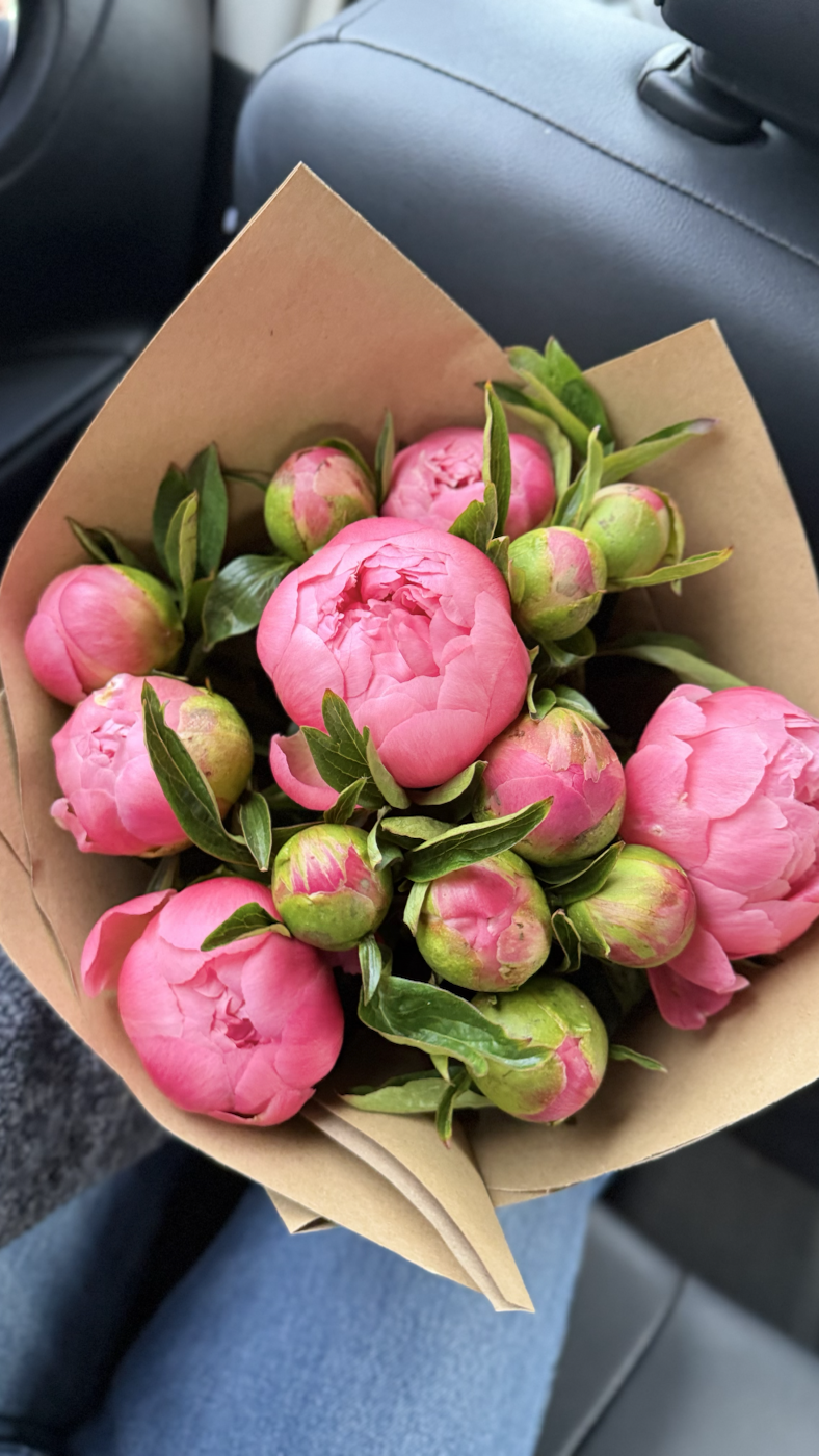Pink peonies wrapped in kraft paper